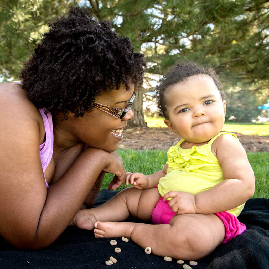 mother and her baby at a park